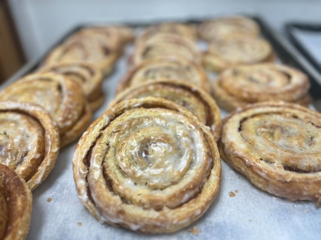 Freshly baked glazed cinnamon rolls fresh from the oven