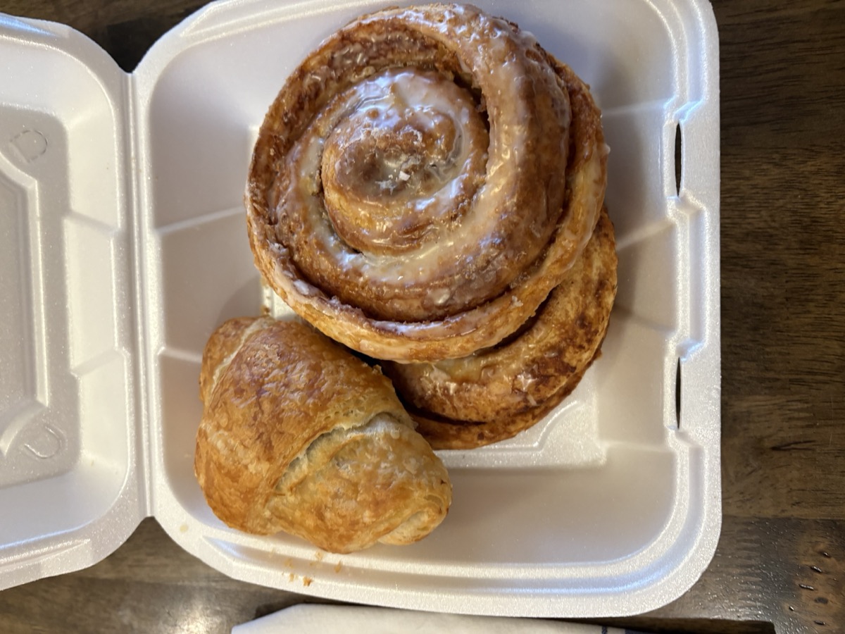 Freshly glazed cinnamon rolls and buttery croissant