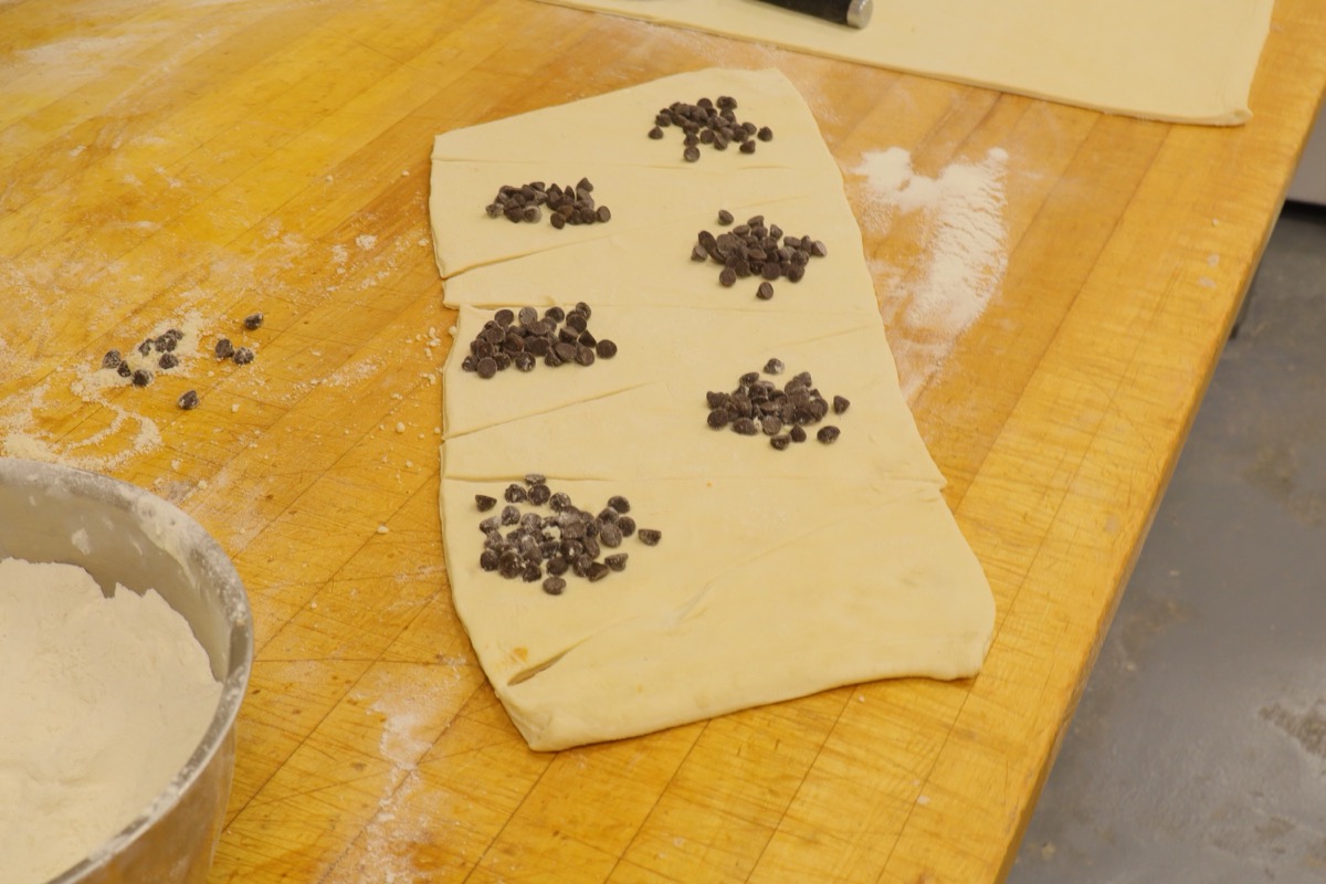 Prep of chocolate croissants with dark chocolate chips